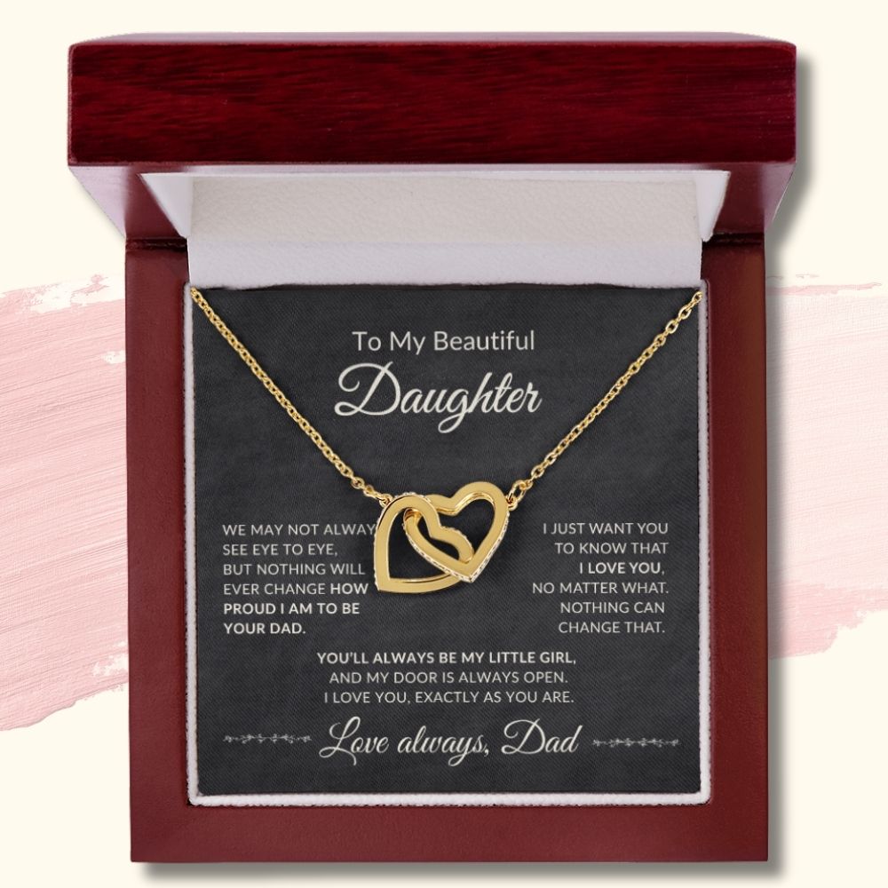 18k yellow gold finish interlocking hearts necklace displayed in a luxury mahogany-style gift box with a message card from Dad to his daughter.