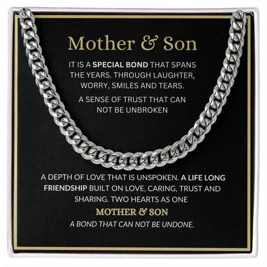 A stainless steel Cuban link chain necklace with a heartfelt message in the center, presented on a black background.