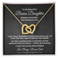 Interlocking hearts necklace in 18K yellow gold finish resting inside a gift box on a message card for bonus daughter titled To My Beautiful Bonus Daughter from Bonus Dad.
