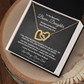 Interlocking hearts necklace in 18K yellow gold finish displayed inside a gift box on a message card for bonus daughter reading To My Beautiful Bonus Daughter.