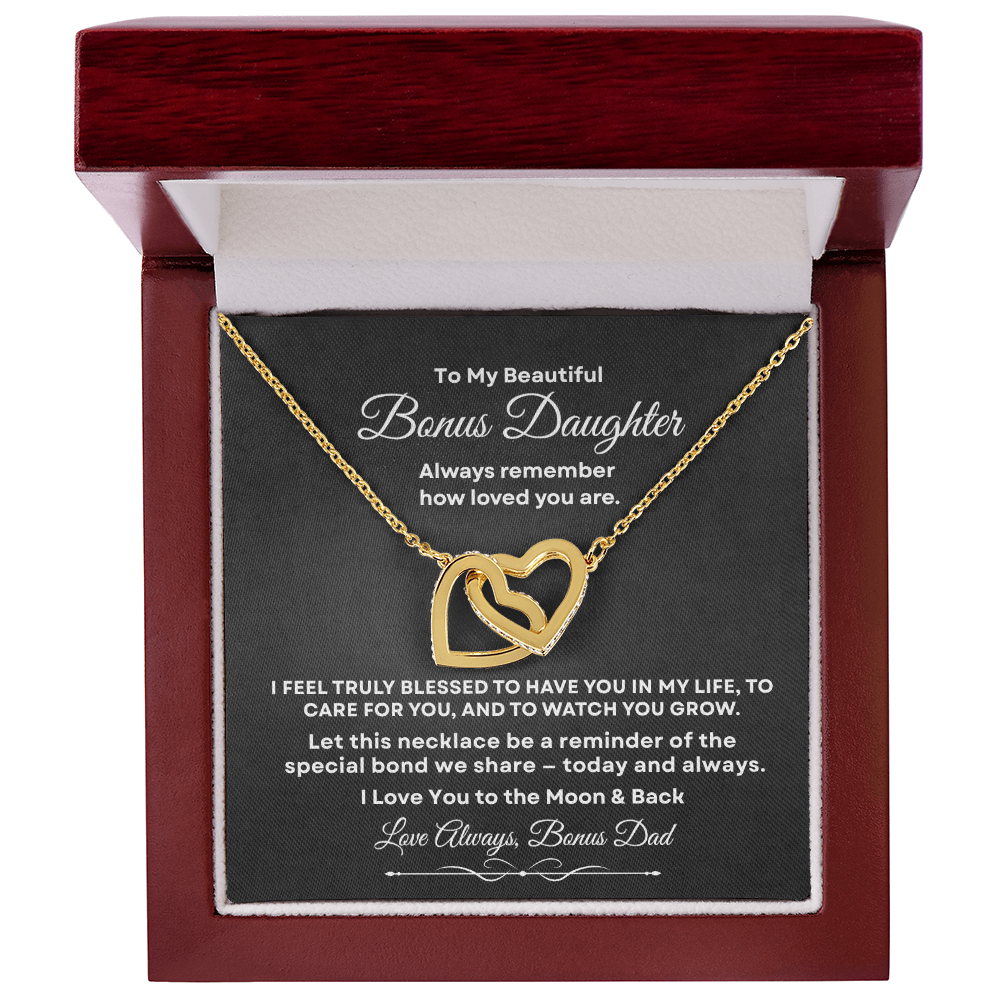 Interlocking hearts necklace in 18K yellow gold finish resting inside a mahogany-style luxury gift box with built-in LED light on a message card for bonus daughter titled To My Beautiful Bonus Daughter from Bonus Dad.