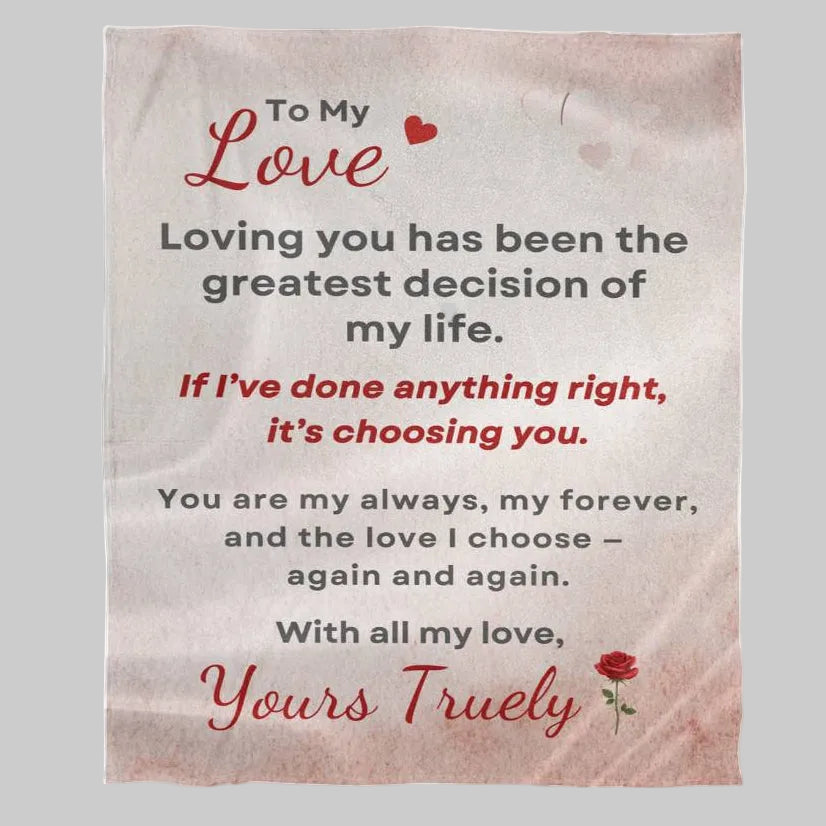Blanket with romantic message and heart designs on a light gray background
