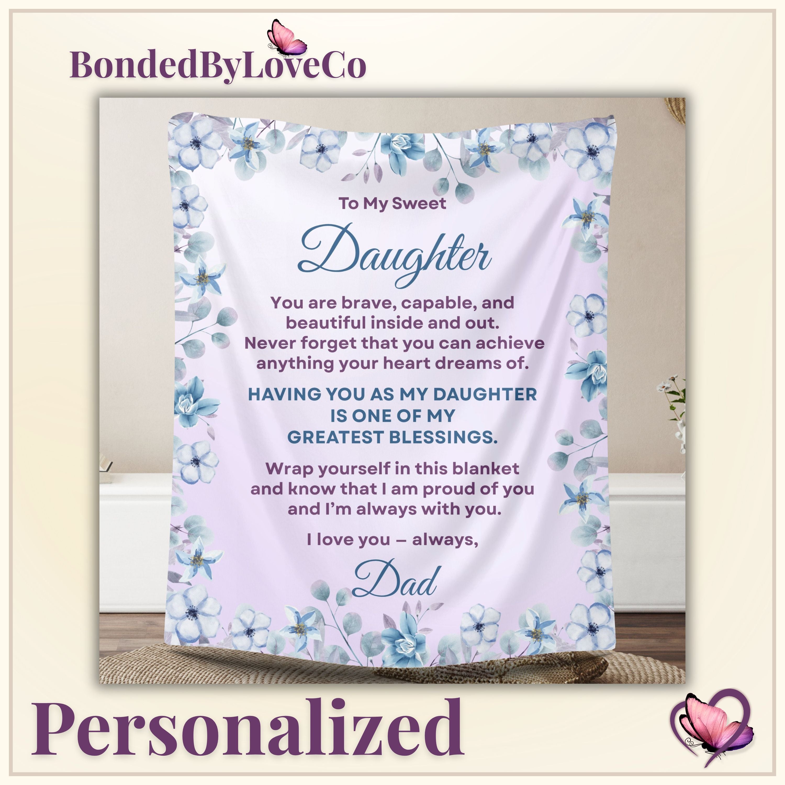 Personalized daughter blanket from Dad in Dusty Rose with a blue floral design, shown hanging in a cozy room setting on thumbnail image
