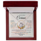 Luxury mahogany gift box with LED spotlight featuring personalized Love Knot necklace.