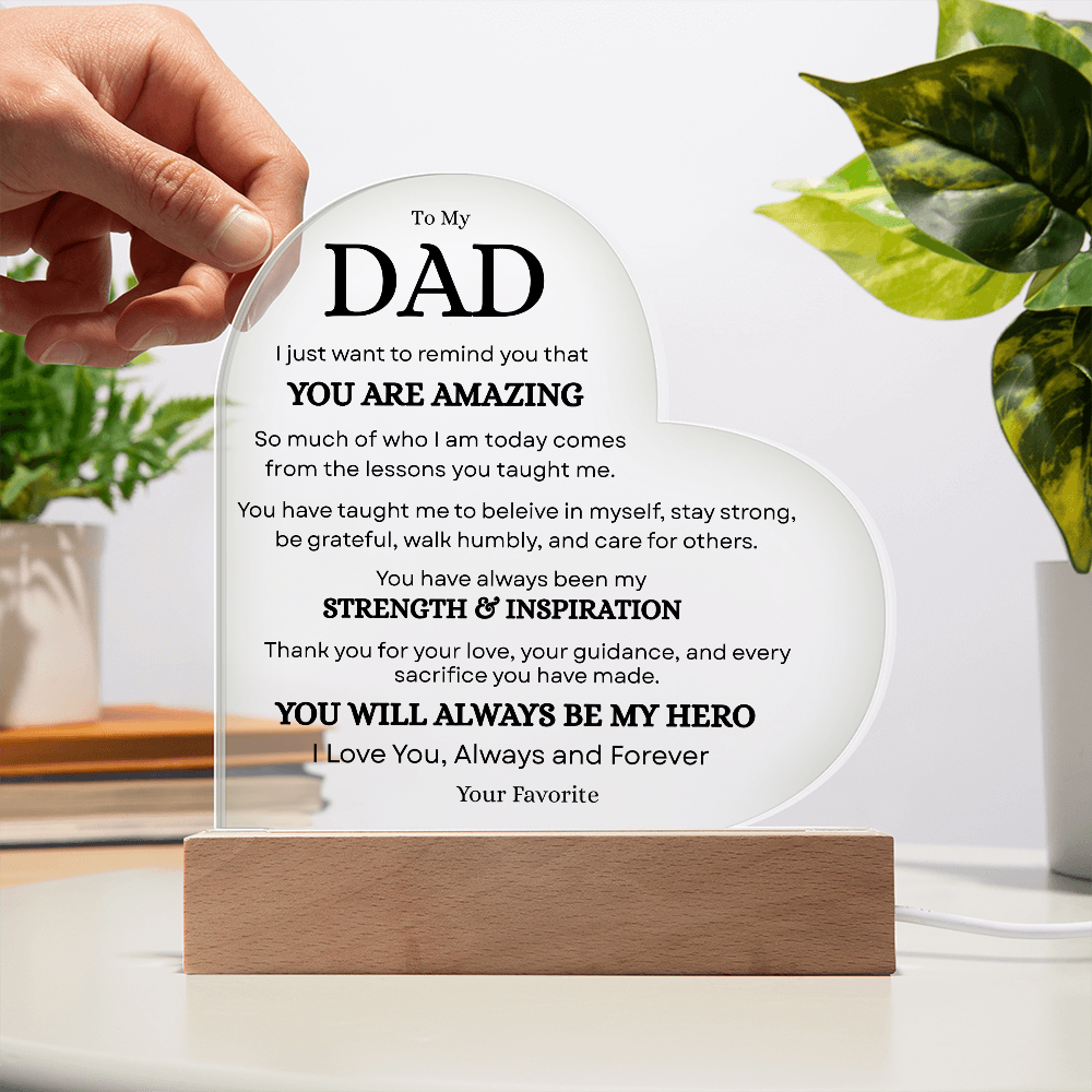 Hand placing personalized Dad acrylic plaque with touching message on wooden LED base
