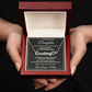 Silver personalized daughter name necklace and message card displayed inside an open mahogany-style luxury gift box.