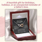 Interlocking hearts necklace in a mahogany-style luxury gift box featuring a header highlighting a heartfelt gift for birthdays, holidays, or an unexpected reminder of a father's love.