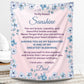 Personalized daughter blanket from Dad in Dusty Rose with a blue floral design, shown hanging in a cozy room setting. 