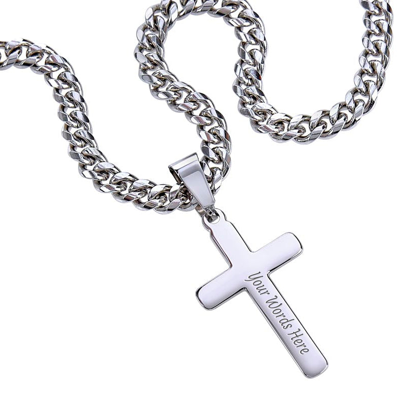 Close-up of a polished stainless steel cross necklace with Cuban chain and custom engraving option for Dad.