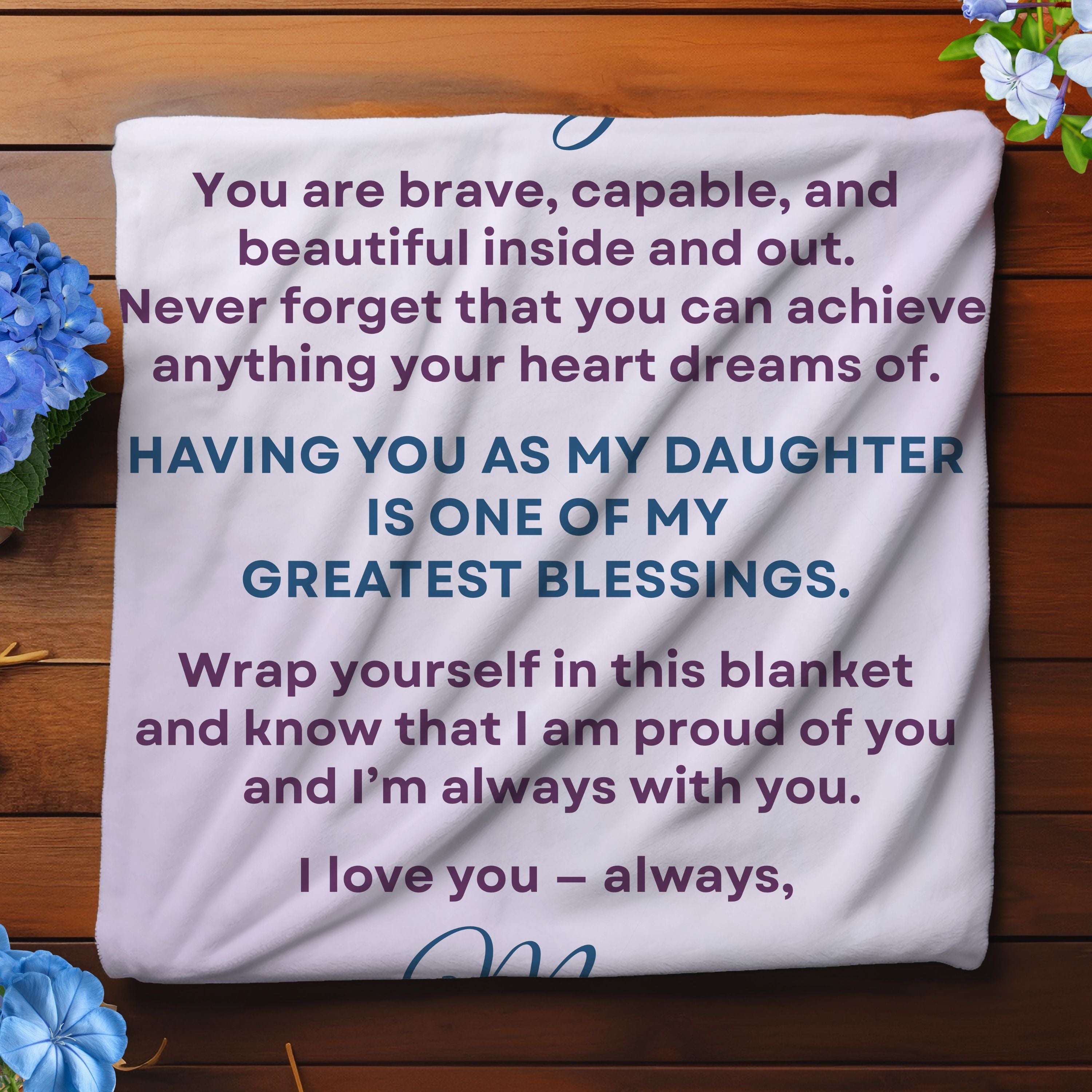 Folded personalized daughter blanket in jersey fleece showing soft texture and printed message detail.