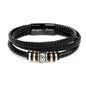 Close-up of Love You Forever men’s bracelet with black braided band, stainless steel beads, and engraved clasp for Dad.