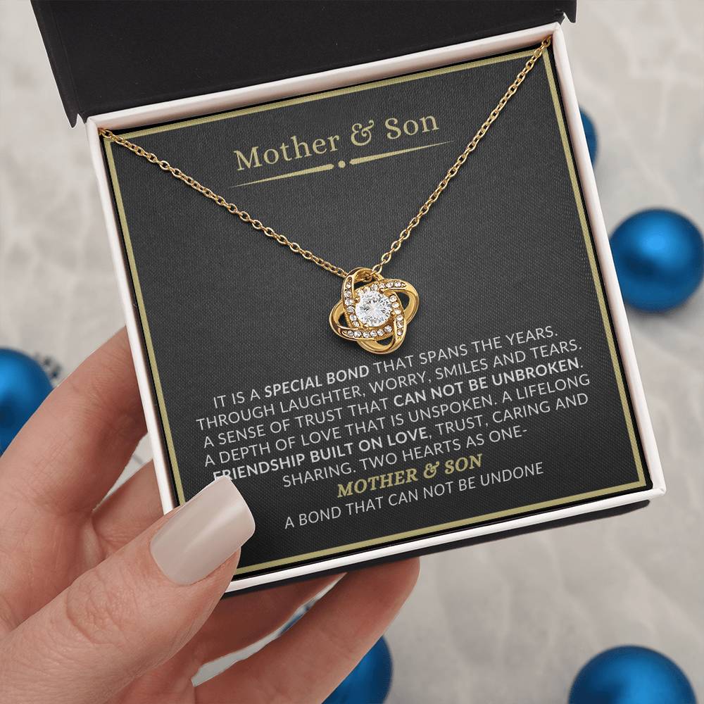 Mother and son love knot necklace with meaningful message card celebrating their lifelong bond