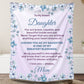 Personalized daughter blanket from Mom in Soft Lavender with a blue floral design, shown hanging in a cozy room setting.