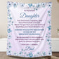 Personalized daughter blanket from Dad in Soft Lavender with a blue floral design, shown hanging in a cozy room setting. 