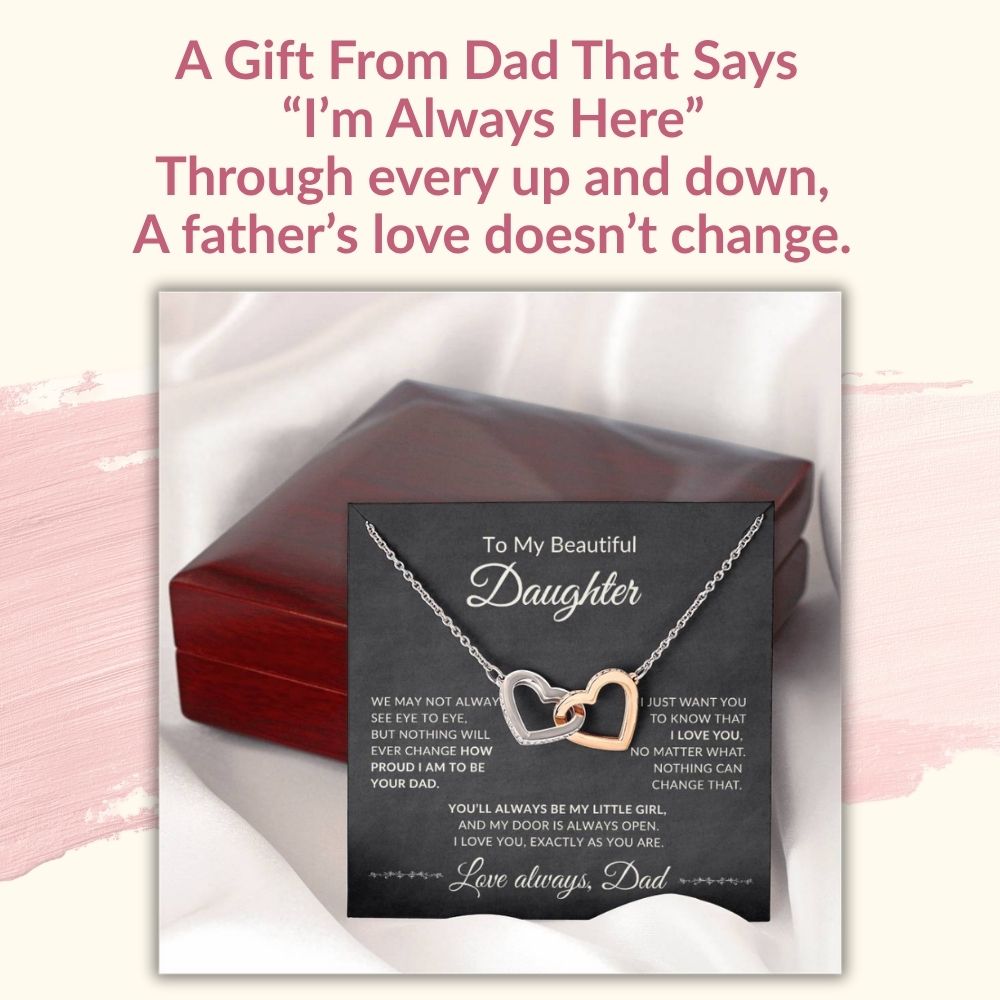 Promotional graphic with the heading A Gift From Dad That Says I'm Always Here, featuring an open luxury gift box with the interlocking hearts necklace and message card.
