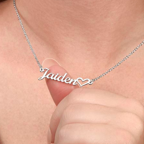 Silver personalized cursive name necklace with heart detail shown being worn to demonstrate necklace size and appearance.
