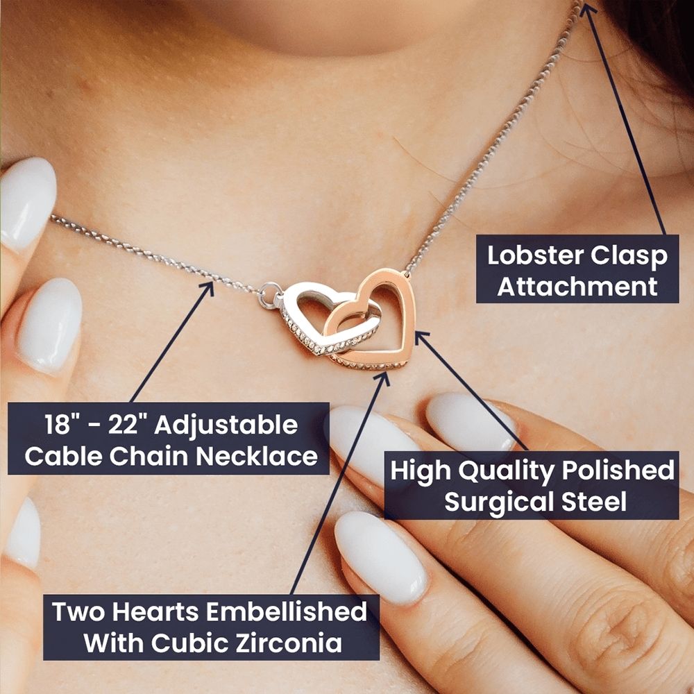 Product detail graphic highlighting the 18 to 22 inch adjustable cable chain, polished surgical steel, cubic zirconia embellished hearts, and lobster clasp attachment.