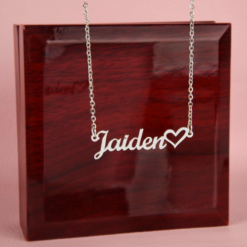 Polished silver personalized name necklace displayed with the mahogany-style luxury jewelry box.
