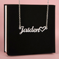 Silver personalized cursive name necklace with heart detail displayed in front of the standard black gift box.